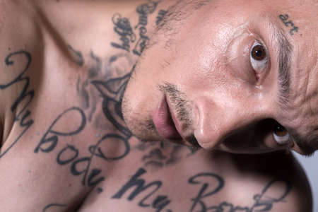 Brutal angry gang man lifestyle, serious handsome guy. Close up face.の写真素材