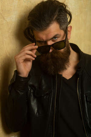 Brutal angry gang man lifestyle, serious handsome guy. Bearded hipster.