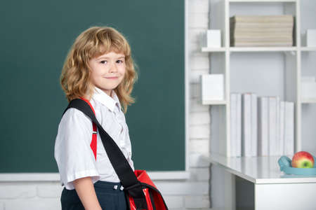 Portrait of funny pupil boy of primary school study. Funny kid at school. Elementary school child in class. Genius child, knowledge day.の写真素材