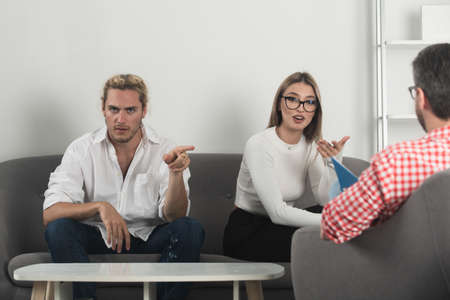 Family psychologist. Psychotherapy with young couple. Depression counseling, family therapy. Marriage counseling, marital problems.の写真素材