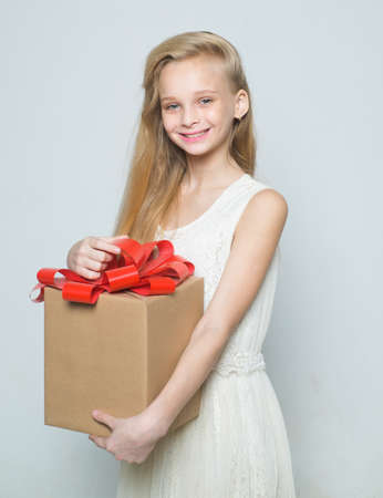 happy blond girl. natural makeup. beauty hairdresser salon. happy birthday. girl with big birthday present. gift box, boxing day. shopping sale. retro blonde teen. Vintage. Thanks for your purchaseの写真素材