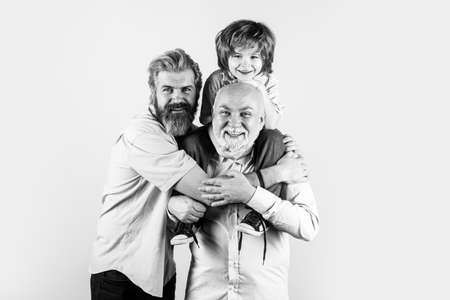 Happy man family concept laugh and have fun together. Three generations ages: grandfather father and...