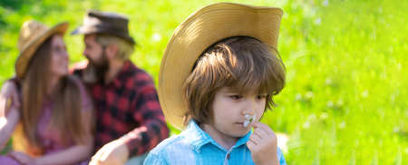 Spring banner with happy family. Family gardener on summer walk and picnic in garden or park....