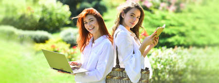 Spring banner with women girlfriends outdoor. Female smiling friends students outdoors. Summer...