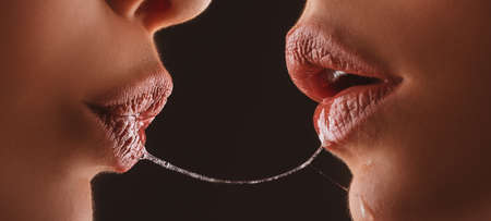Sexy girl kiss. Lesbian lips with saliva. Female lip. Romantic girls love. Erotic desire