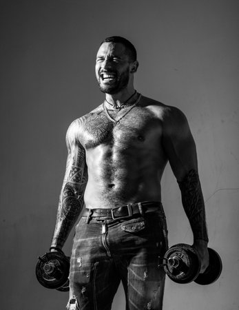 Macho confident face with muscular body sportsman bodybuilder. Muscular macho six packs hold...