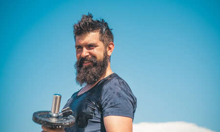 Fit man. Young muscular man with naked torso working out outdoor. Athletic male sport man exercising. Fitness sports concept.の写真素材