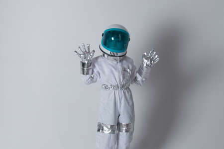 Child boy imagines himself to be an astronaut in an space helmet. Success, creative and start up...
