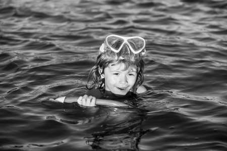 Happy kids boy play in the sea.の写真素材