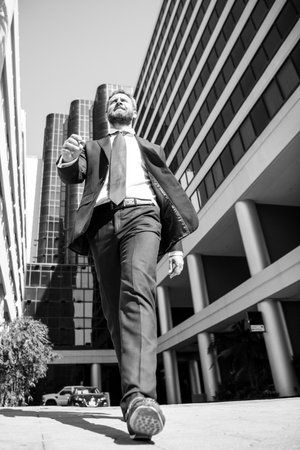 Business man walking on the street. Businessman walk near modern office center.の写真素材