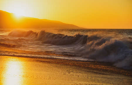 Ocean seascapes. Sea waves. Sunset on beach. Resort.
