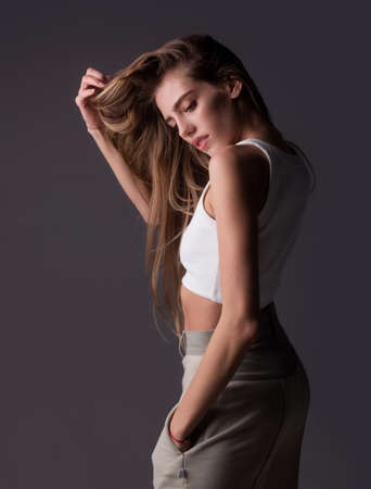 Woman with beauty face, facial portrait. Beautiful tender sensual young girl. Fashion model isolated in studio.の写真素材