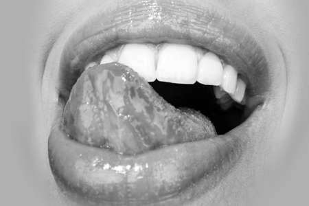 Sensual lick. Smiling mouthes. Happiness laughing and enjoying mouth icon, cheerful smile, human emotions concept. Happy woman lips.の写真素材