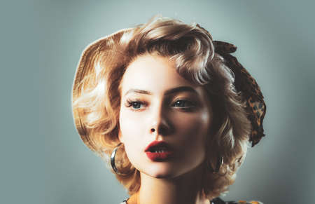 Pin up girl vintage. Beautiful woman pin up style portrait in retro makeup. Red lips Portrait of beautiful young woman. Pin-up style.の写真素材