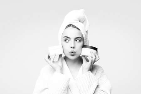 Woman proposing a cosmetics product. Gestures for advertisement.の写真素材