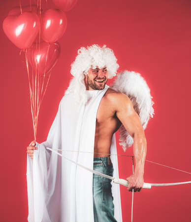 Sexy angel. Valentines day. Handsome athlete man with angels wings.の写真素材