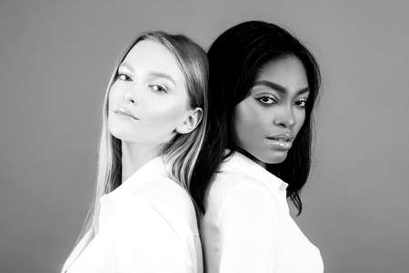 Interracial multiethnic lesbian concept. Mixed nation woman relationships.の写真素材