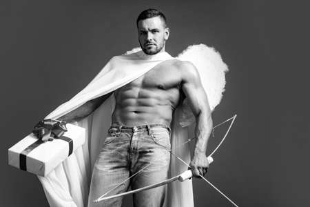 Valentines Day. Handsome man angel. Sexy guy cupid with angels wings. Amour. February 14. Isolated...