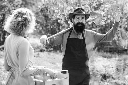 Farmers couple working in field. Portrait of pair of farms Working In Garden Together. Couple in the farm on countryside background.の写真素材