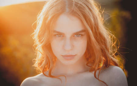 Beautiful young woman posing outdoor. Stylish girl in summer casual outfit. Outdoor female portrait.の写真素材