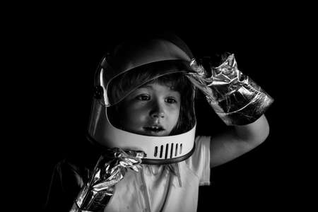 Child boy playing astronaut with spaceman. Close up excited kids face.の写真素材