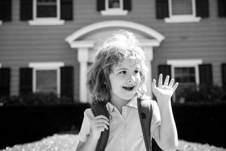 Portrait of little boy outdoor home, near house. Concept of kids face close-up. Head shoot children portrait.の写真素材