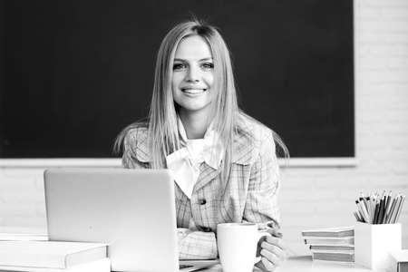 Portrait of happy female university student study lesson at school or university. Webinar e-learning at school, distance education.の写真素材