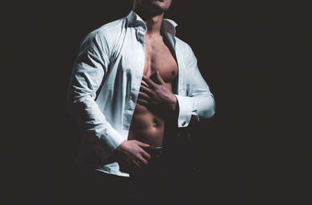 Hot boy. Sexy torso of a muscular man. Sensual handsome muscular gay with open shirt and hot body.の写真素材
