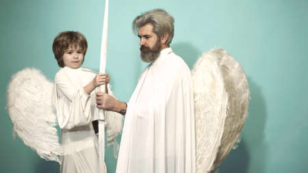 Valentin father and son with bow arrow ready to shoot. Family men with feathers wings of Cupid...