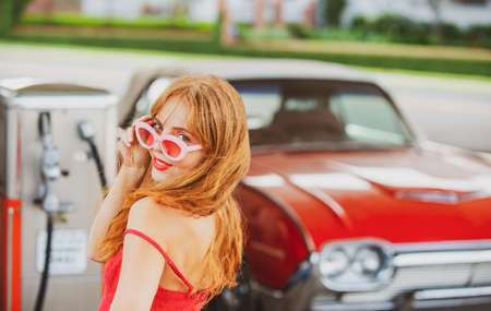 American vintage car. Old auto. Sensual woman retro automobile.