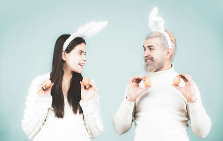 Easter family with Easter eggs. Holidays. Family celebrate Easter. Couple with eggs for Easter....