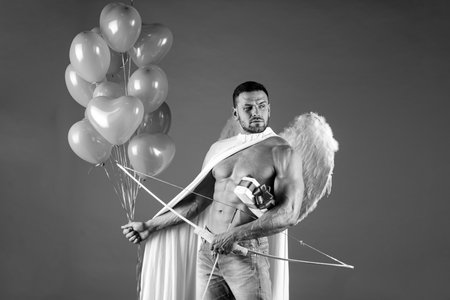 Valentines Day angel man. Sexy male with angels wings. Arrow of love, cupid, amour. February 14....