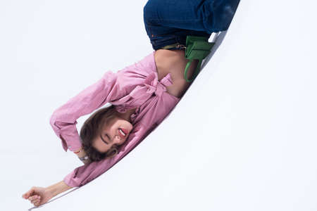 Fashion woman in pink shirt and jeans. Fashion model, elegant woman in fashion dress posing in the...