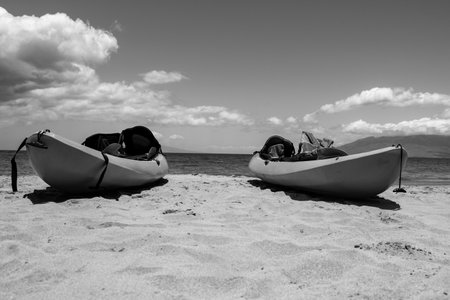 Kayak tourism. Calm sea beach background. Summer tropical beach with sand. Ocean water. Natural seascape.の写真素材