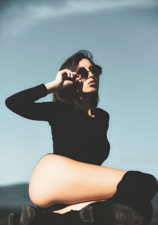 Serious desire girl. Passion and temptation. Hot babe. Concept of beauty. Portrait sensual woman in the nature background. Woman in erotic underwear. Portrait of serious desire woman.の写真素材