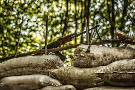 War gun, rifle and machine gun, assault rifle and machine gun, attacking enemy. Military photo, army background.の写真素材