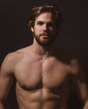 Portrait of young sexy handsome man with bare, torso, athletic gay, male model, muscular hot boy.の写真素材