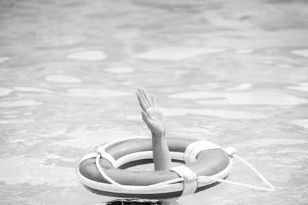 Drowning concept. No swimming. Rescue swimming ring in water. Safety water equipment.