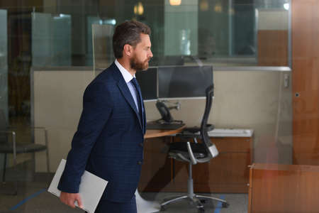 Business man walking on the street. Businessman walk near modern office center.