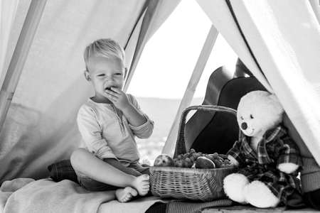 Portrait of happy smiling child boy on nature background. Only fun is on my mind. Boy on camping.