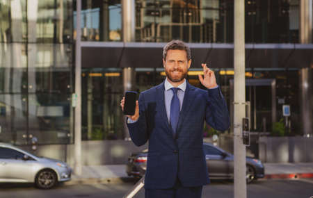 Businessman with phone. Portrait of cheerful Business man office worker talking on mobile phone...