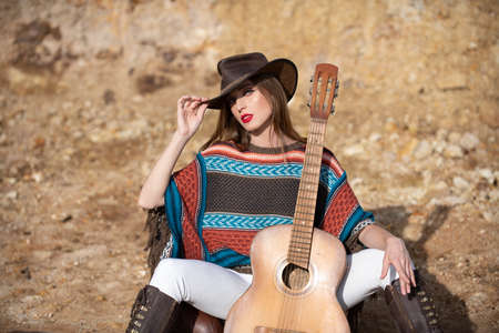 Countryside woman in boho style and hat. Fashion outdoor photo of gorgeous sensual woman in elegant...
