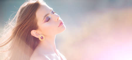 Natural beauty face. Attractive happy young woman close up portrait at spring. Freedom lifestyle...