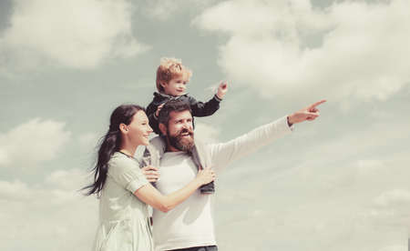 Daddy, mommy and child son. Happy family - child son playing with paper airplane. Portrait of happy...
