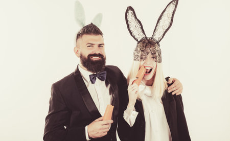 Happy easter and funny easter day. Bunny rabbit ears costume. Funny couple wearing bunny ears on...