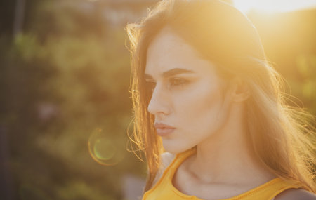 Beautiful young woman posing outdoor. Stylish girl in summer casual outfit. Outdoor female portrait.の写真素材