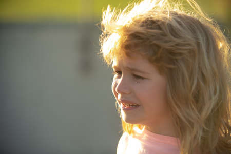 Sad child boy portrait. Children bad emotion and expression concept.の写真素材