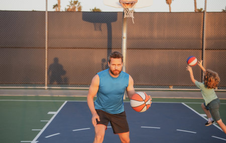 Basketball training, man coach. Funny team training basketball. Trainer with kid boy to score a...