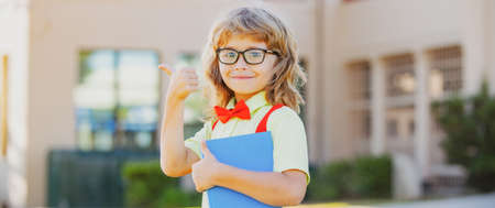 School child boy at school. Schoolboy going back to school. Kids education concept.の写真素材