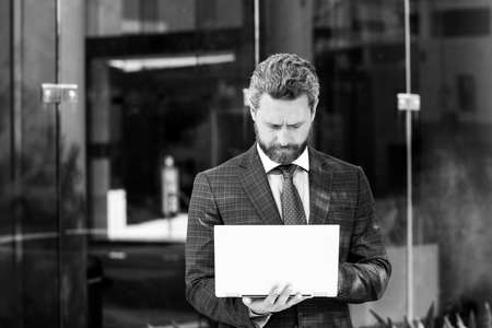 Urban business man. Casual businessman wearing suit jacket. Portrait of a mature businessman.の写真素材